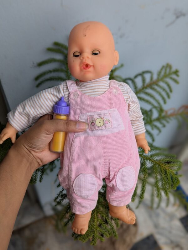 Baby doll with feeder